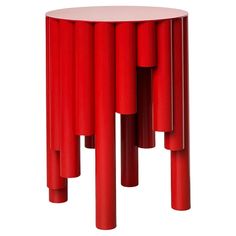 a red side table with multiple columns on it