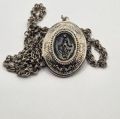 Gorgeous locket pendant necklace in excellent pre-loved condition. Attached tag has mark "1928"  Locket could be opened and closed. Pendant is 2 1/2" long, Locket is 2" long, Chain is 31" long.  This pendant locket brought back the time,  when Lady hide something very important in the locket. Diana The Huntress, The Huntress, Pendant Locket, 1928 Jewelry, Locket Pendant Necklace, Vintage Victorian, Jewelry Companies, Long Chain, Victorian Style