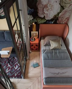 a bed sitting in the middle of a room next to a window