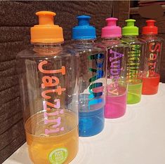 several water bottles lined up next to each other