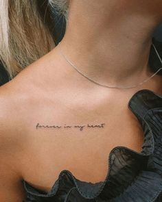 the back of a woman's neck with an inscription written in cursive writing