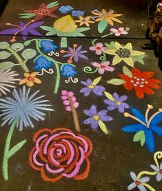 the sidewalk is decorated with flowers and butterflies