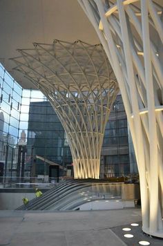 an architectural building with white columns and lights