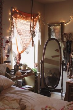 a bed room with a large mirror and lights