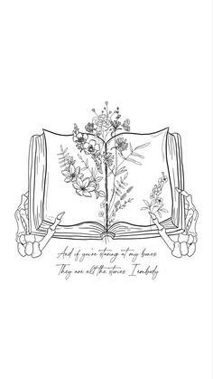 an open book with flowers on it