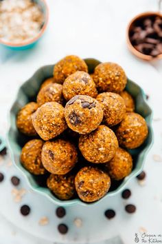 a bowl filled with chocolate chip energy bites