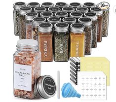 an assortment of spices and seasonings in glass jars on a white background with labels