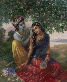 two women are sitting under a tree and one is holding a mirror in her hand