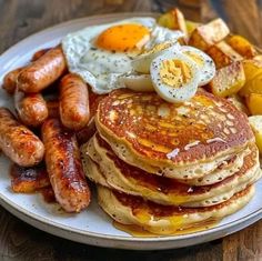 pancakes, sausages and eggs are on a plate