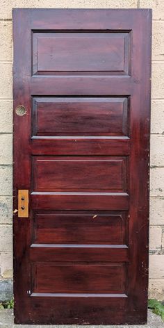 a wooden door with a metal handle on it