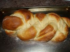 a braided bread sitting on top of a metal pan