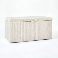 an upholstered storage box on a white background