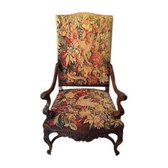 an ornately decorated chair with flowers on it's back and armrests