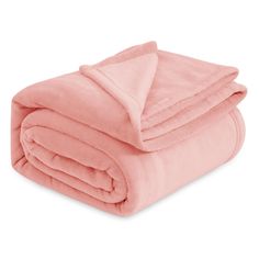 a pink blanket folded on top of each other