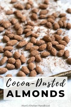 cocoa - dusted almonds on top of a baking sheet with the title overlay