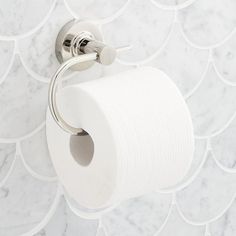 a roll of toilet paper is hanging on the wall