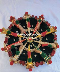 an arrangement of decorative items on a white tablecloth with the words flower designer work