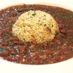 a white plate topped with beans and rice