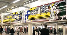 people are walking around in an airport with colorful artwork on the wall and ceiling above them