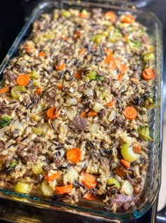 a casserole dish filled with meat and vegetables