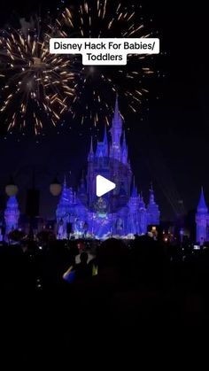 the disney castle for babies / toddlers is lit up at night with fireworks in the sky