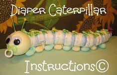 a caterpillar made out of diapers with the words, diaper caterpillar instructions