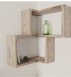 two wooden shelves with vases on top of one shelf and another shelf above the other