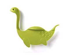 a green dinosaur shaped object on a white background