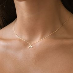 Celebrate the magic and beauty of the season with our Reindeer Charm Necklace, available in your choice of 14k Gold Filled, Sterling Silver, 14k Rose Gold Filled, or luxurious 14K Solid Gold.  This enchanting necklace features a beautifully detailed reindeer charm, symbolizing grace, strength, and the festive spirit. Perfect for holiday enthusiasts, nature lovers, or anyone who appreciates elegant and meaningful jewelry, this necklace is a delightful addition to any collection. Care Instructions Gold Deer Necklace, Deer Necklace, Gold Deer, Initial Disc Necklace, Engraved Bar Necklace, Bar Necklace Personalized, Silver Bar Necklace, Christmas Necklace, Gold Bar Necklace