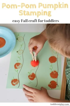 a young boy is painting pumpkins on a green paper with the words pom - pom stamping