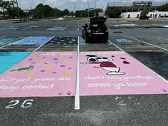 an empty parking lot has been painted with cartoon characters