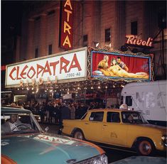 cars and trucks are parked in front of the theatre marquee for cielopatha