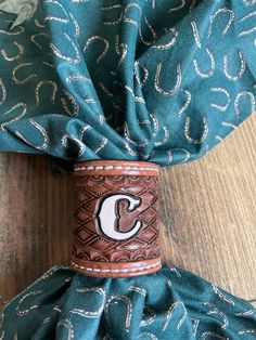 a tie with the letter c on it