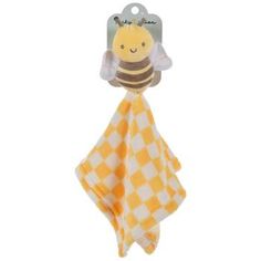 a yellow and white checkered towel with a bee on it's back, hanging from a hook