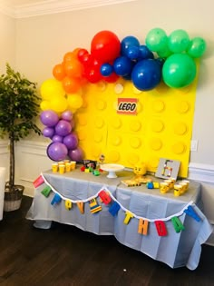 a lego themed birthday party with balloons and decorations