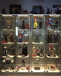 a display case filled with lots of action figures
