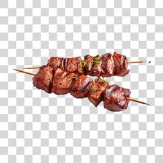 two skewers with meat on them sitting next to each other in front of a white background