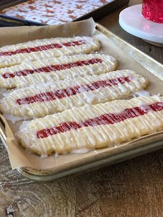 there are some cookies that have been decorated with icing and strawberry jam on them