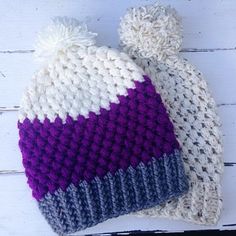 two knitted hats sitting on top of each other