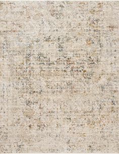 an area rug with many different colors and patterns on the carpet, including beiges, browns