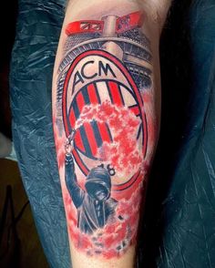 a man's arm with a tattoo on it that says acm and has a statue of liberty in the center