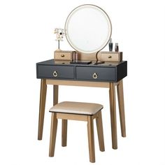 a vanity table with a mirror and stool