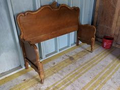 an old wooden bench sitting in front of a door