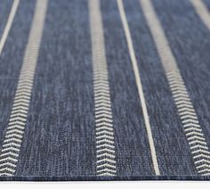 a blue rug with white lines on it