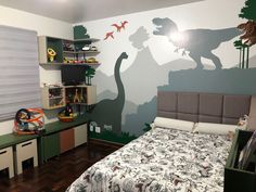 a child's bedroom decorated with dinosaur wallpaper