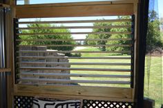 a window with wooden slats on the outside