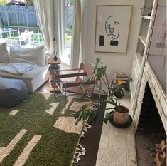 a living room filled with furniture and a fire place