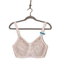 This Bali Flower Underwire Bra Combines Elegance With Excellent Support, Featuring A Delicate Floral Design On The Cups That Adds A Touch Of Feminine Charm. The Underwire Construction Provides Gentle Lift And Shaping, While The Full-Coverage Cups Ensure A Smooth Silhouette Under Any Outfit. Designed With Adjustable Straps And A Comfortable Back Closure, This Bra Offers A Personalized Fit That Stays In Place Throughout The Day. Made From Soft, Breathable Fabric, It Is Ideal For Everyday Wear, Providing Both Style And Support. A Versatile Addition To Any Lingerie Collection, Perfect For Achieving A Refined, Polished Look. New With Tags Lingerie Collection, Underwire Bra, Polished Look, Breathable Fabric, Bali, Adjustable Straps, Everyday Wear, Floral Design, The Day