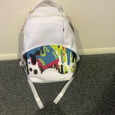 Great Condition. White Sprayground Backpack With Money Design On It. White Casual Bags For Streetwear, Casual White Bag For Streetwear, Trendy White Bags For Streetwear, Trendy White Streetwear Bags, White Zipper Closure Bag For Streetwear, Everyday Urban White Bag, White Urban Everyday Bag, Urban Everyday White Bag, White Sporty Backpack With Adjustable Strap