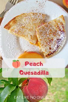 peach quesadilla on a white plate with powdered sugar and fresh peaches